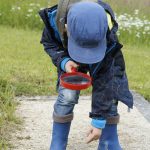 boy magnifying glass