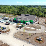 An aerial view of the new Superior Branch. The green exterior insulation is visible, and the landscape is beginning to take place.